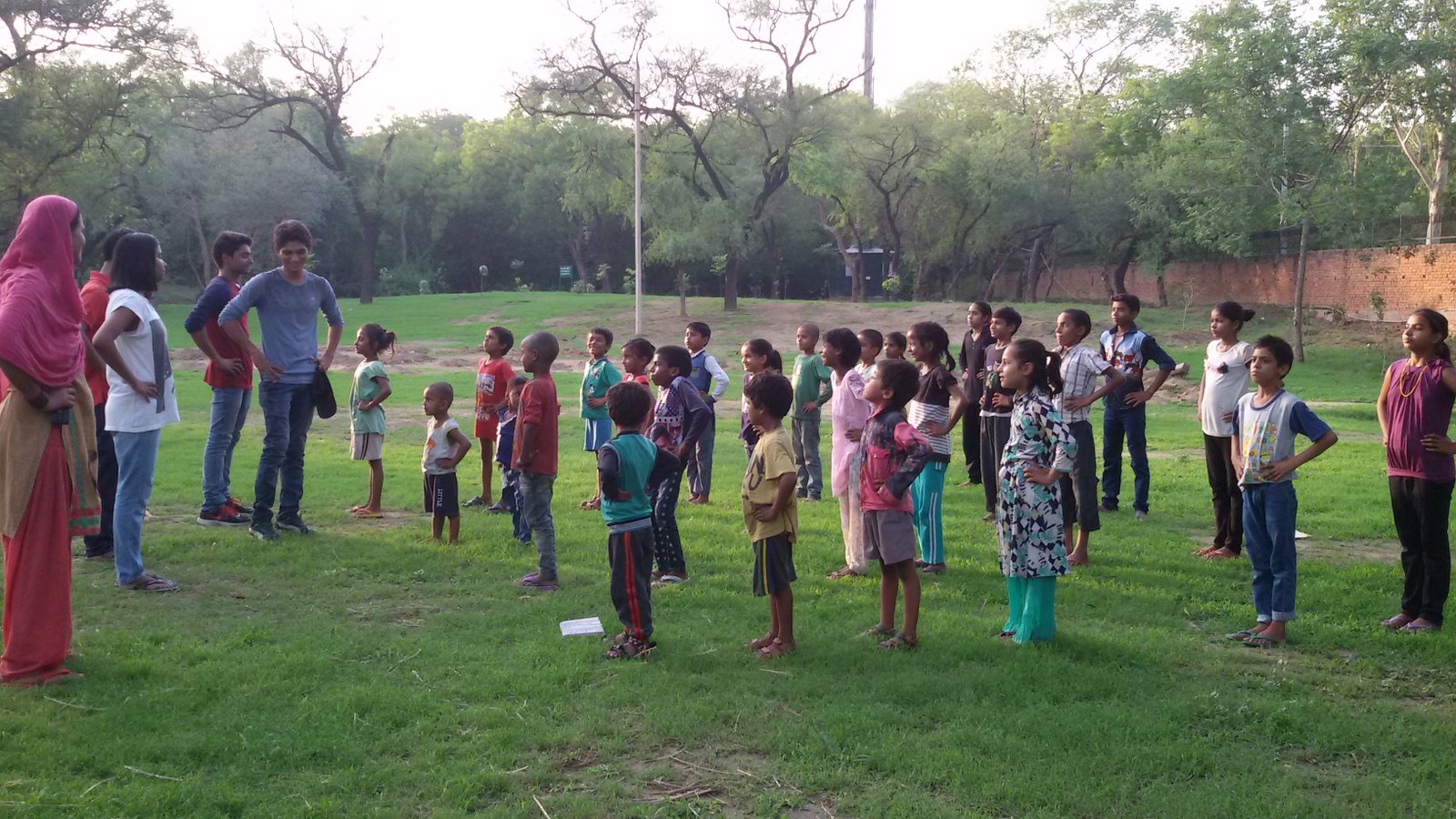ARP India volunteers leading an outdoor learning session with children